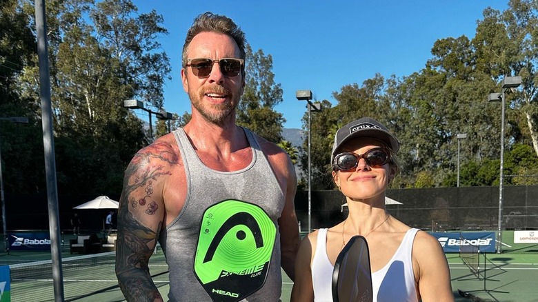 Dax Shepard and Kristen Bell playing tennis