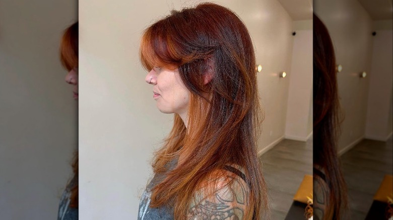 Woman with curtain bangs