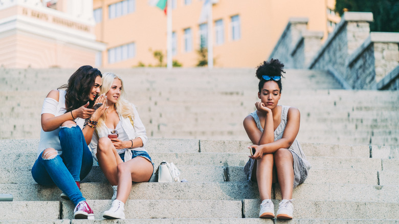 woman getting gossiped about