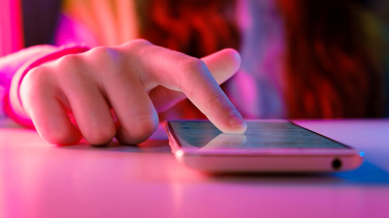 Person scrolling through social media