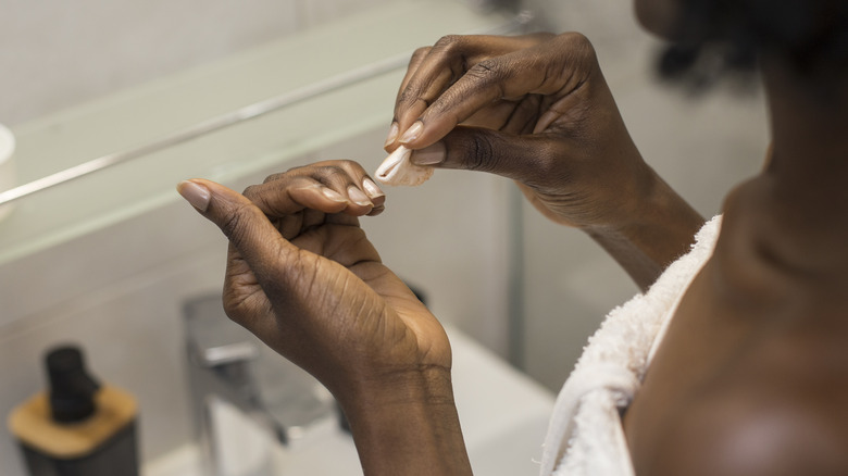 Woman cleaning nails
