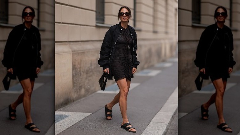 woman in black birkenstocks