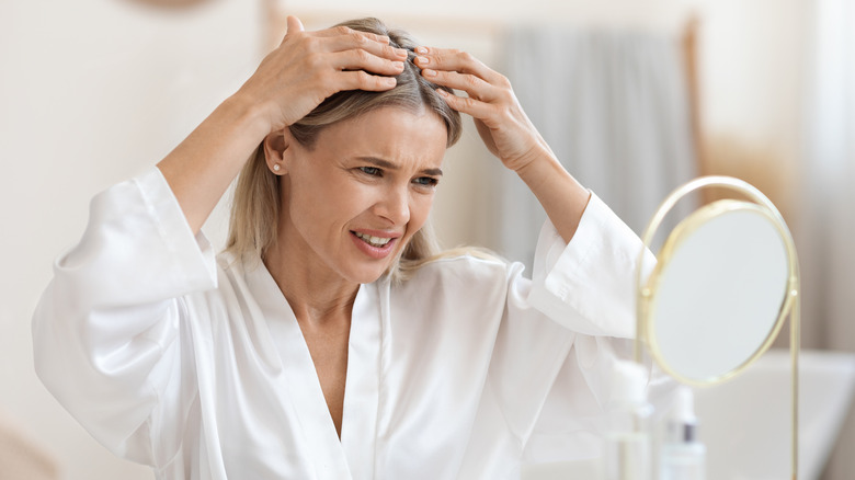 Woman touching her hair