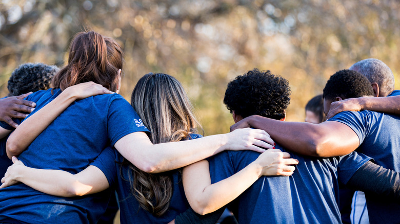 Back of a group embracing
