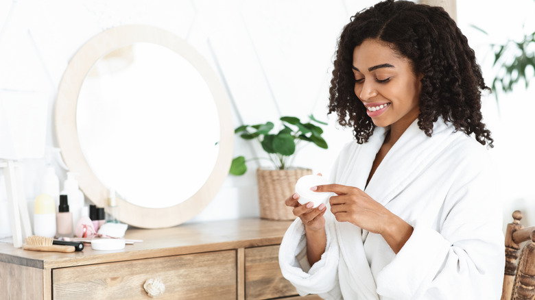 Woman looking at beauty products
