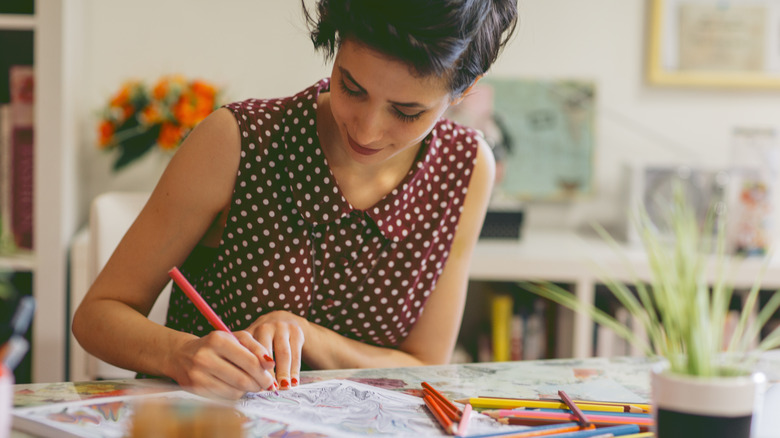 Woman coloring on her desk 