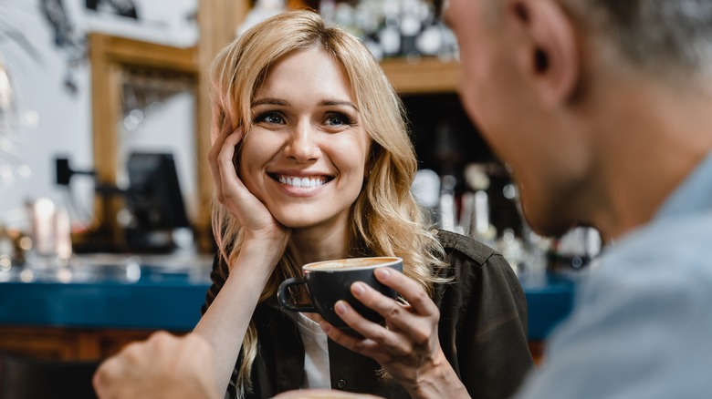 Woman smiling at date
