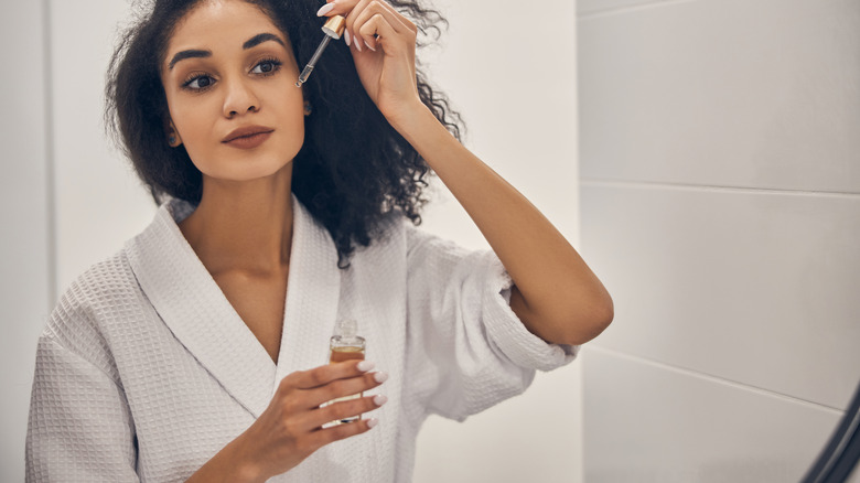 Woman applying skincare